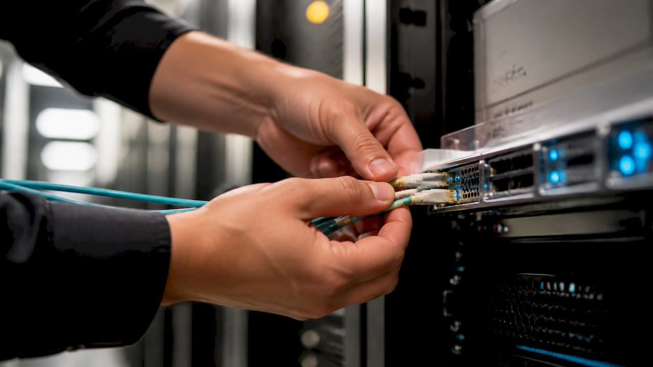 Engineer patching fibre into an exchange switch